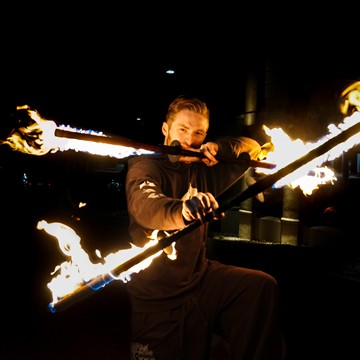 Alex spinning double fire staffs